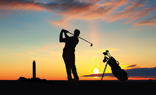 A man playing golf